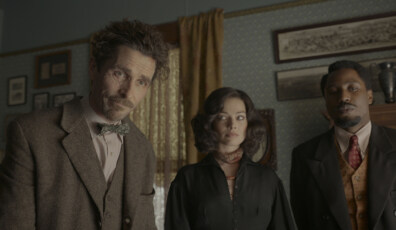 (L-R): Christian Bale, Margot Robbie, and John David Washington in 20th Century Studios' AMSTERDAM. Photo courtesy of 20th Century Studios. All Rights Reserved.