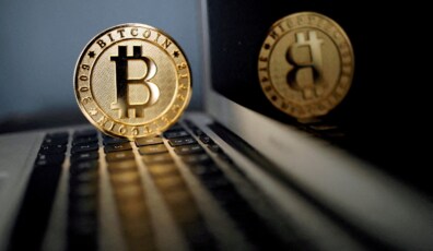 FILE PHOTO: A bitcoin representation is seen in an illustration picture taken at La Maison du Bitcoin in Paris, France, June 23, 2017. REUTERS/Benoit Tessier