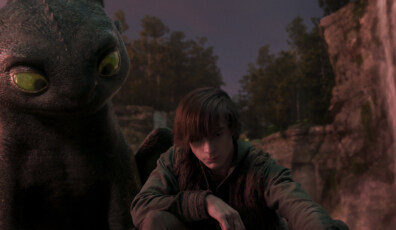 (from left) Night Fury dragon, Toothless, and Hiccup (Mason Thames) in Universal Pictures’ live-action How to Train Your Dragon, written and directed by Dean DeBlois.