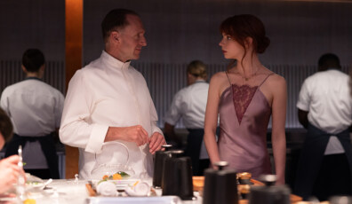 Ralph Fiennes and Anya Taylor-Joy in the film THE MENU. Photo by Eric Zachanowich. Courtesy of Searchlight Pictures. © 2022 20th Century Studios All Rights Reserved